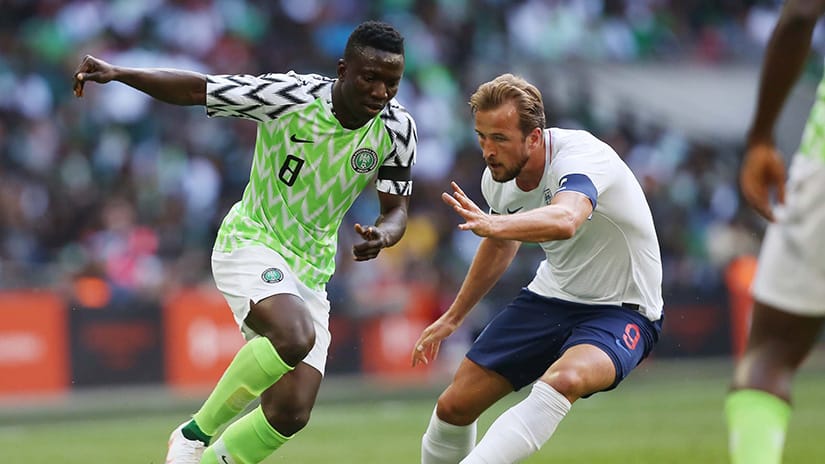 Oghenekaro Etebo Nigeria left and Harry Kane England right