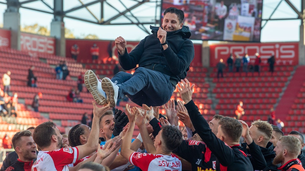 Christian Keller is thrown into the air by the Regensburg players.