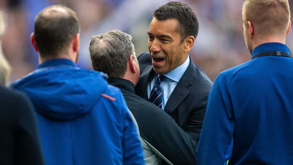 United in jubilation just a few days ago: Rangers coach Giovanni van Bronckhorst and Jimmy Bell.