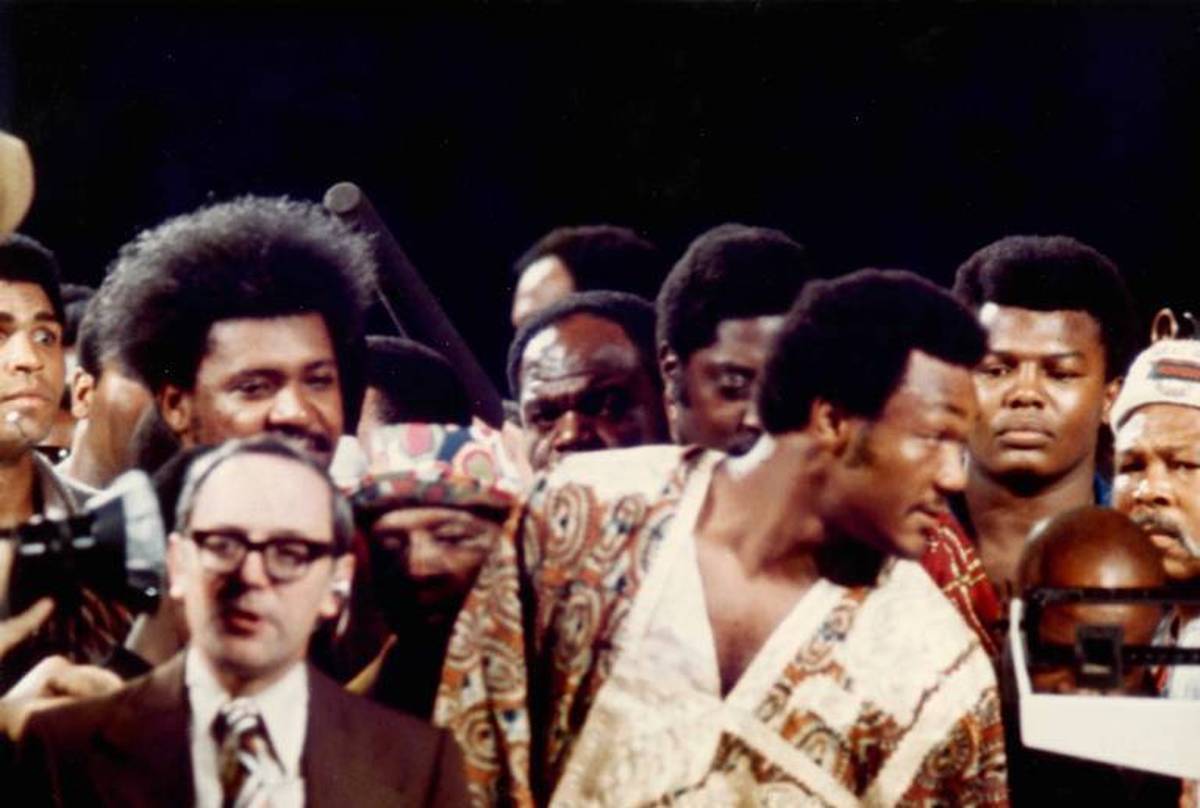 Don King (left) and George Foreman (front right) at the weigh-in before the fight in Zaire